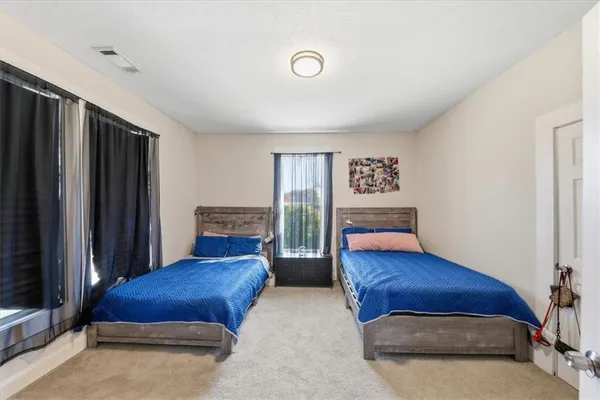 a room with furniture and a flat screen tv