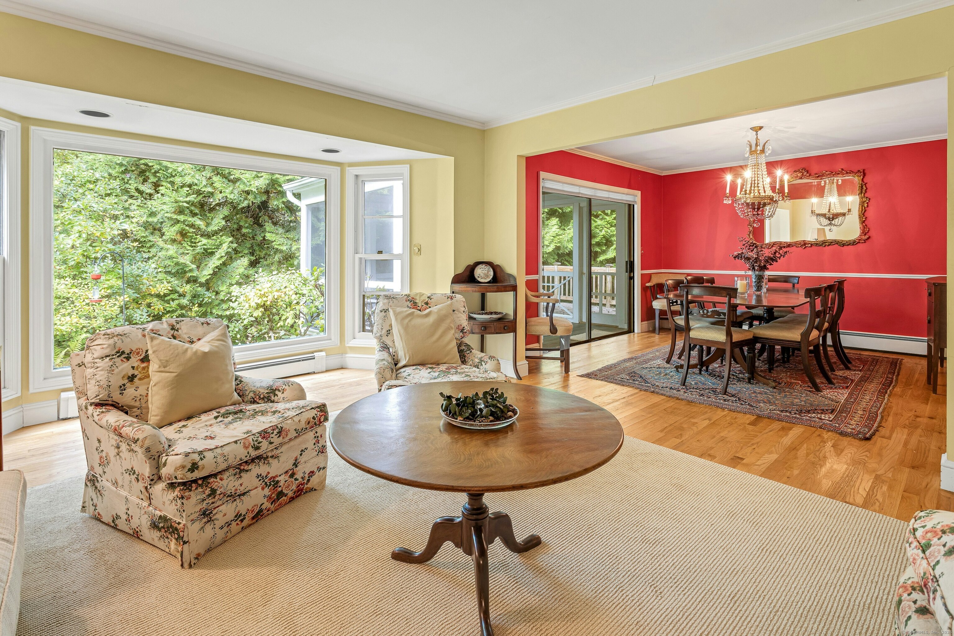 261 Linden Tree Road Wilton, CT 06897 - Photo 13 of 27 a living room with furniture and a large window