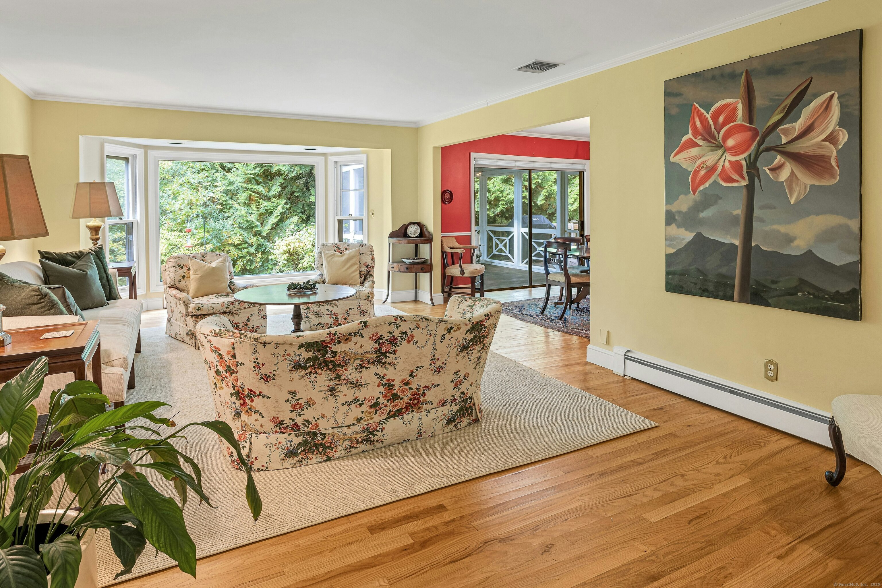 261 Linden Tree Road Wilton, CT 06897 - Photo 14 of 27 a living room with furniture large window and wooden floor