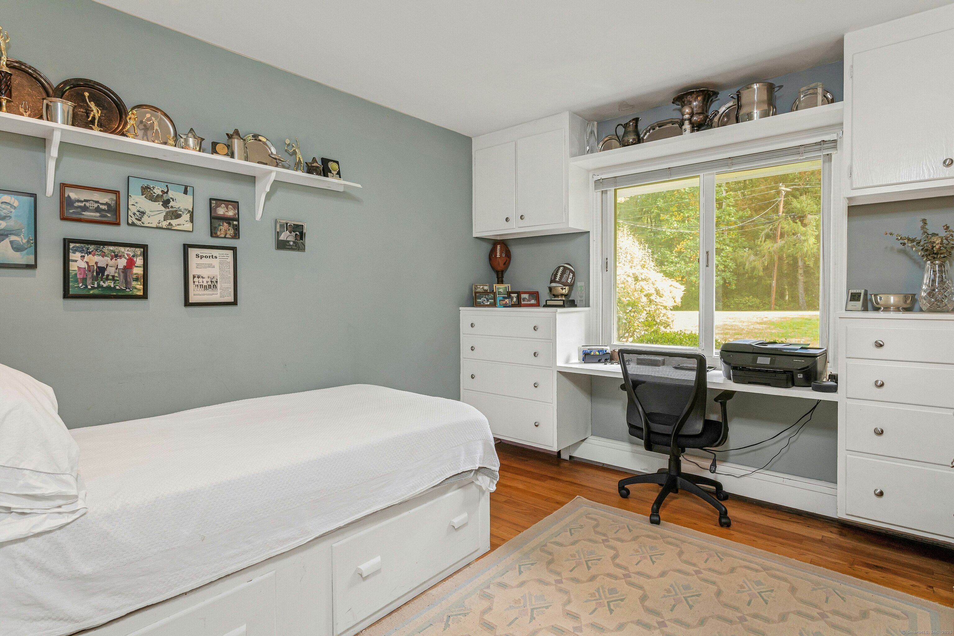 261 Linden Tree Road Wilton, CT 06897 - Photo 18 of 27 a bedroom with a bed and a window