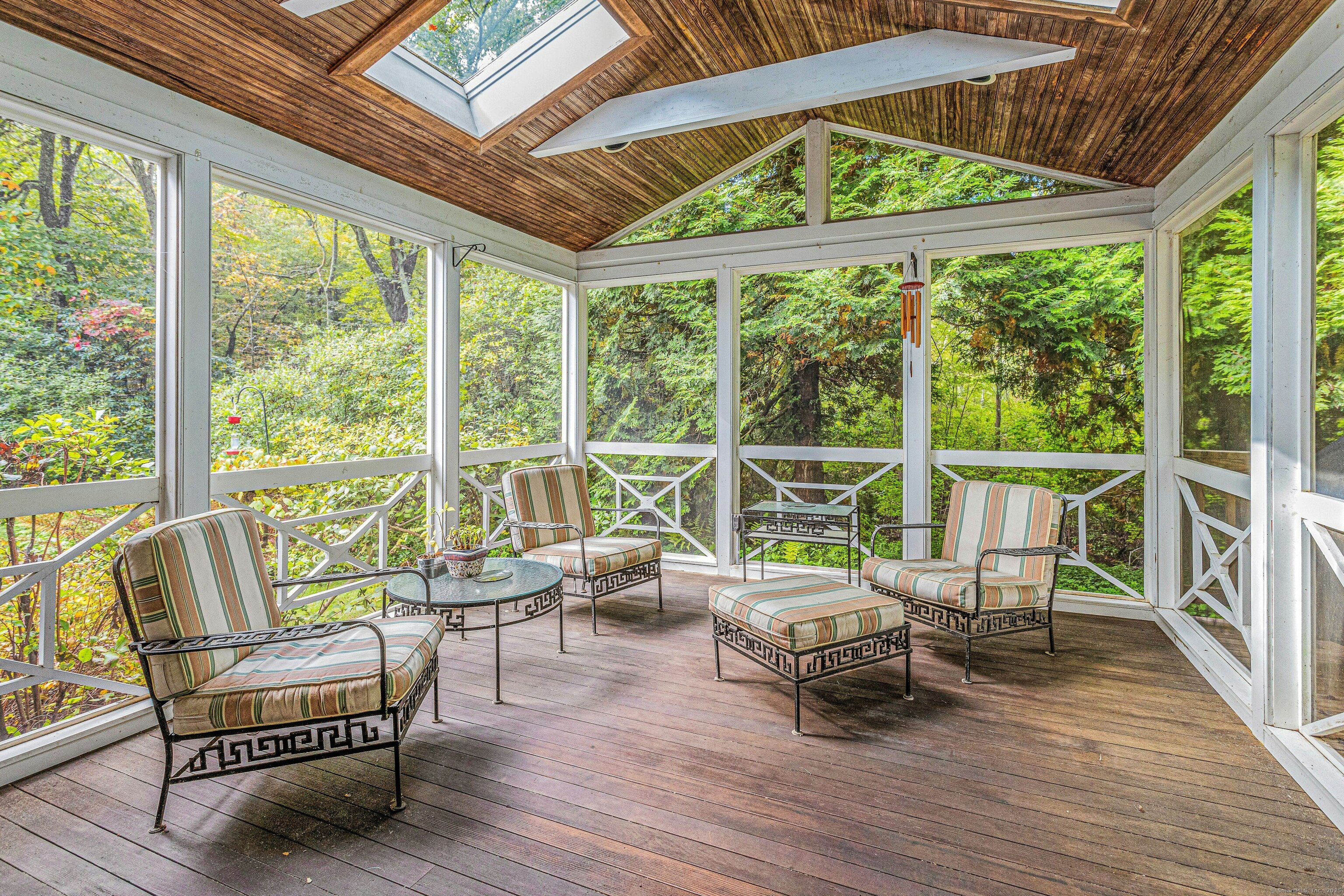 261 Linden Tree Road Wilton, CT 06897 - Photo 22 of 27 a living room with furniture and floor to ceiling windows