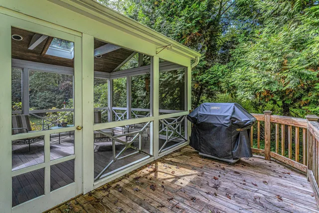 a view of a patio with a table and chairs