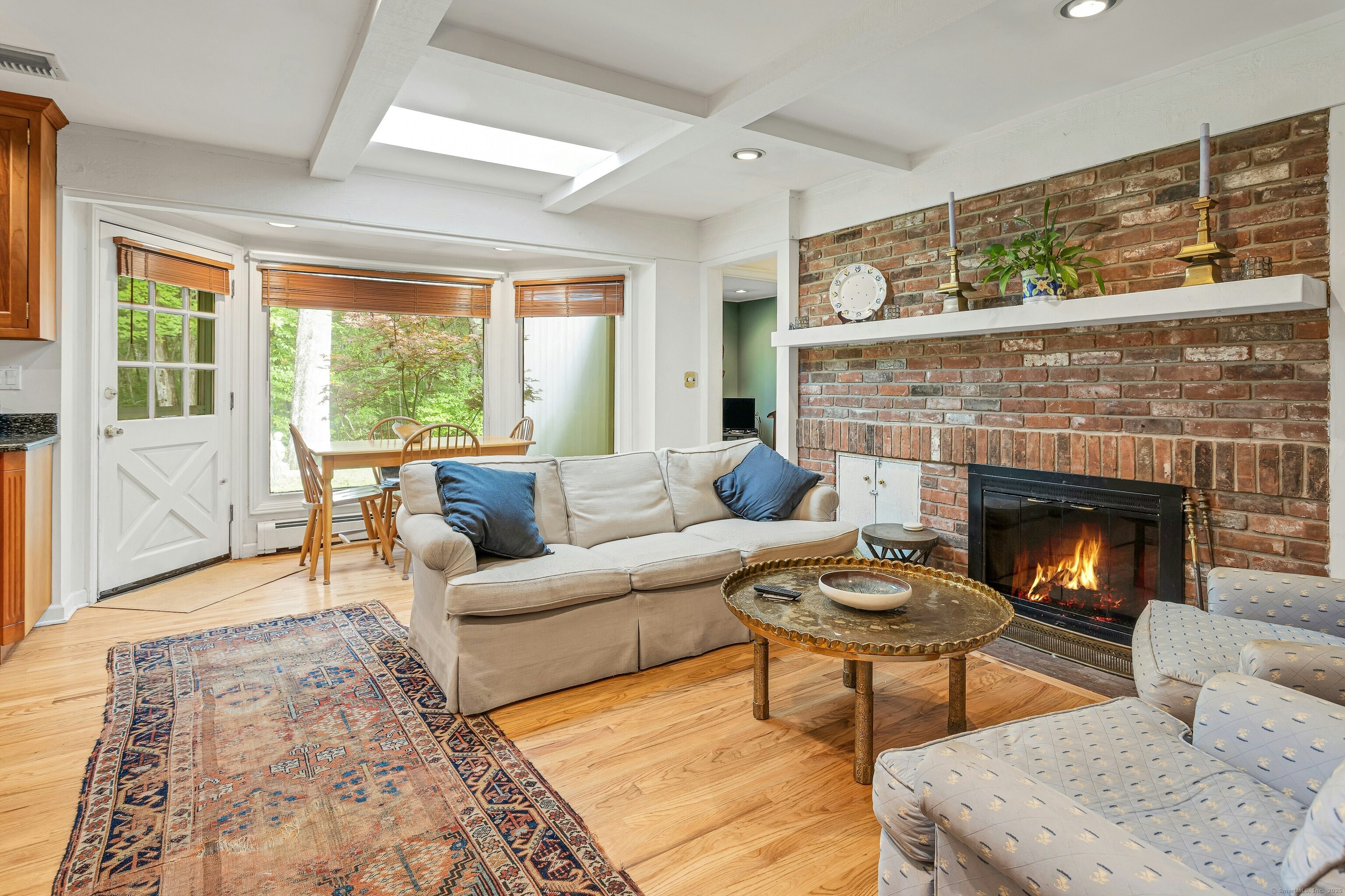261 Linden Tree Road Wilton, CT 06897 - Photo 6 of 27 a living room with furniture and a fireplace
