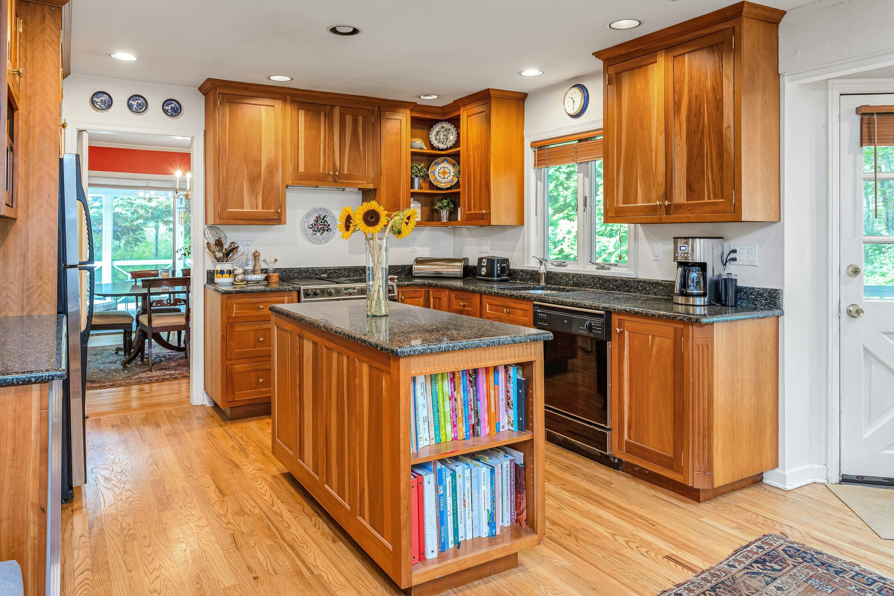 261 Linden Tree Road Wilton, CT 06897 - Photo 10 of 27 a kitchen with stainless steel appliances granite countertop a stove a sink dishwasher and a refrigerator with wooden floor