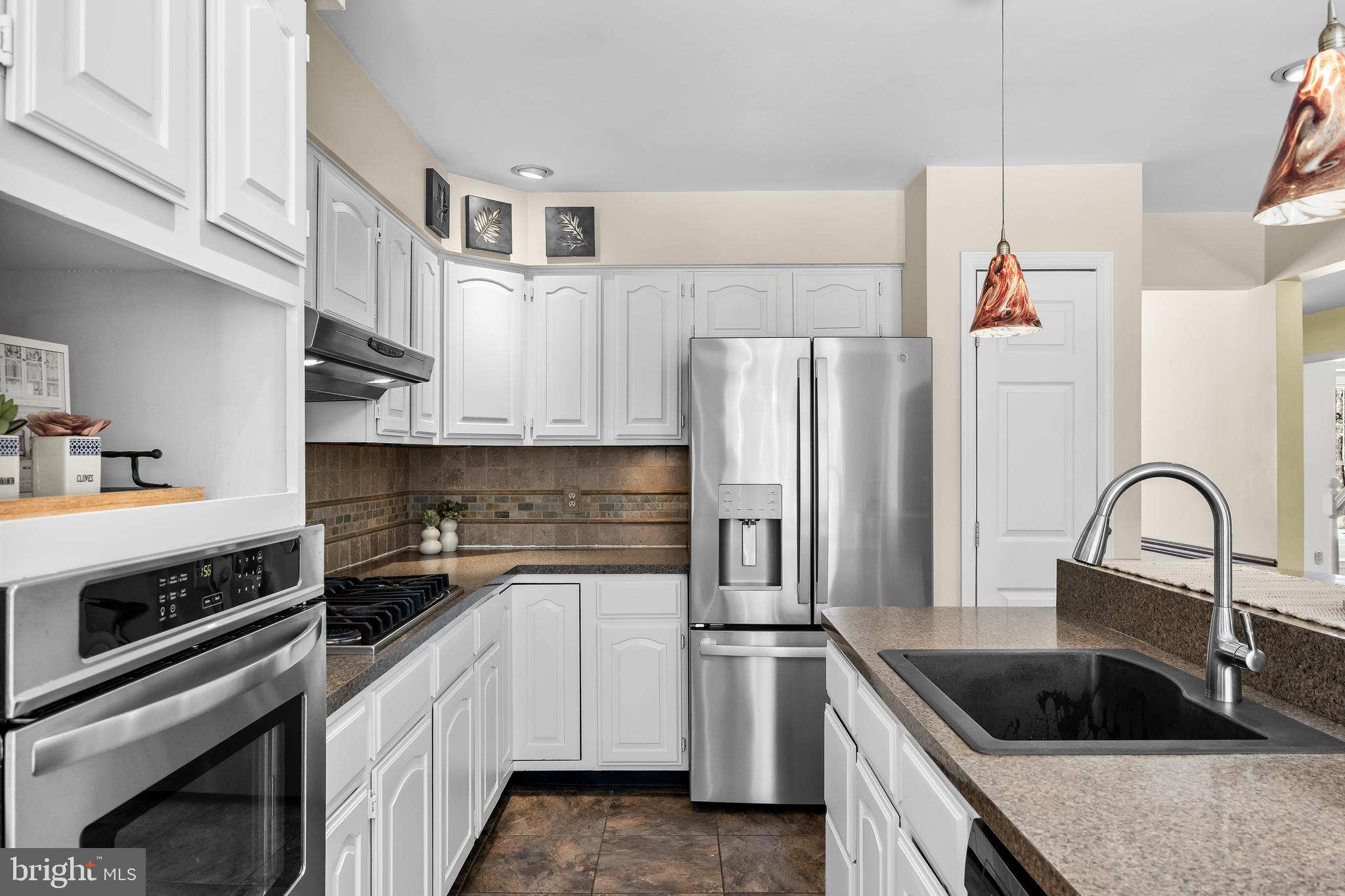 10 Lexington Court Shamong, NJ 08088 - Photo 10 of 47 a kitchen with stainless steel appliances a refrigerator sink and cabinets