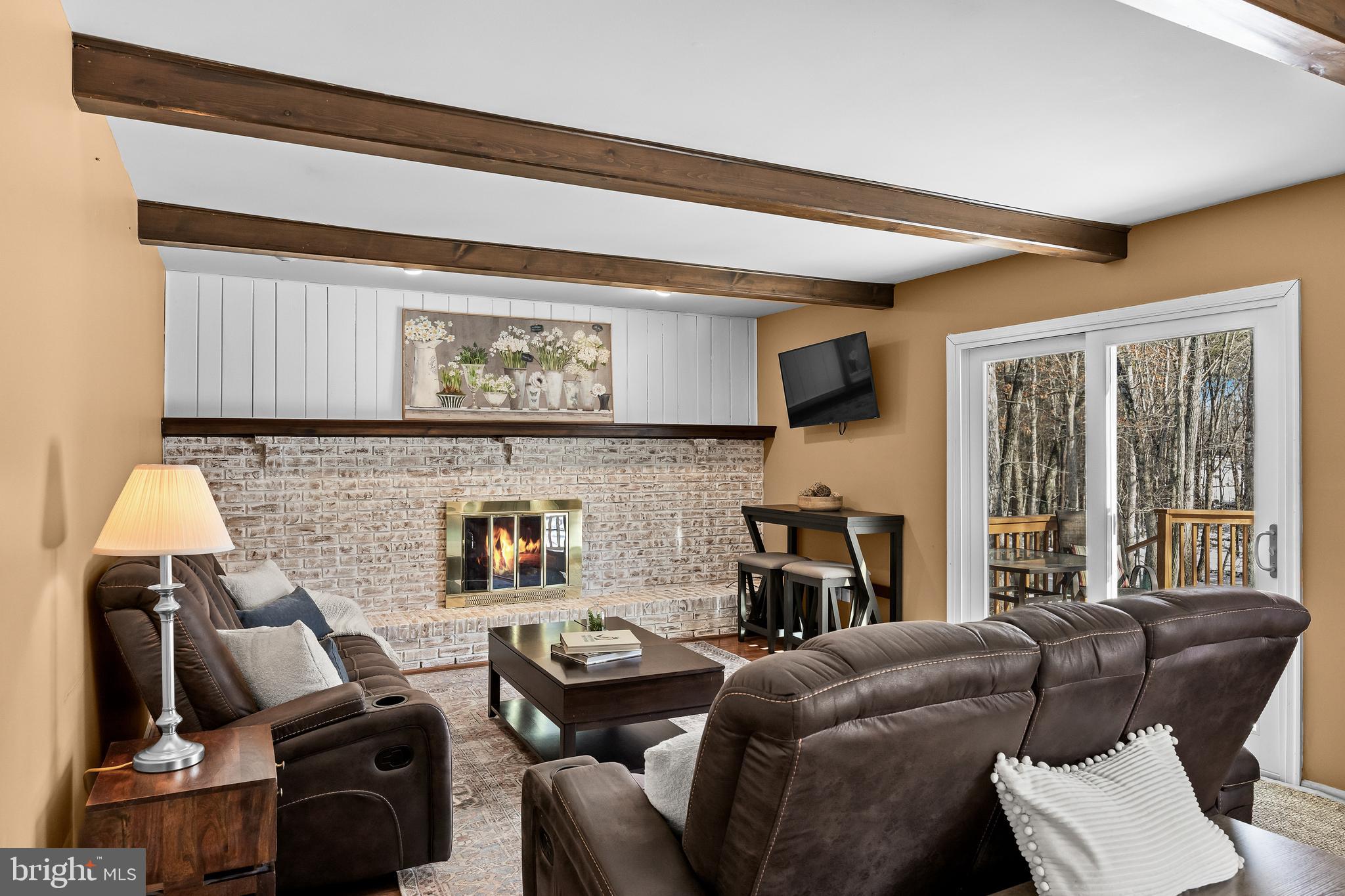 10 Lexington Court Shamong, NJ 08088 - Photo 13 of 47 a living room with furniture and a fireplace