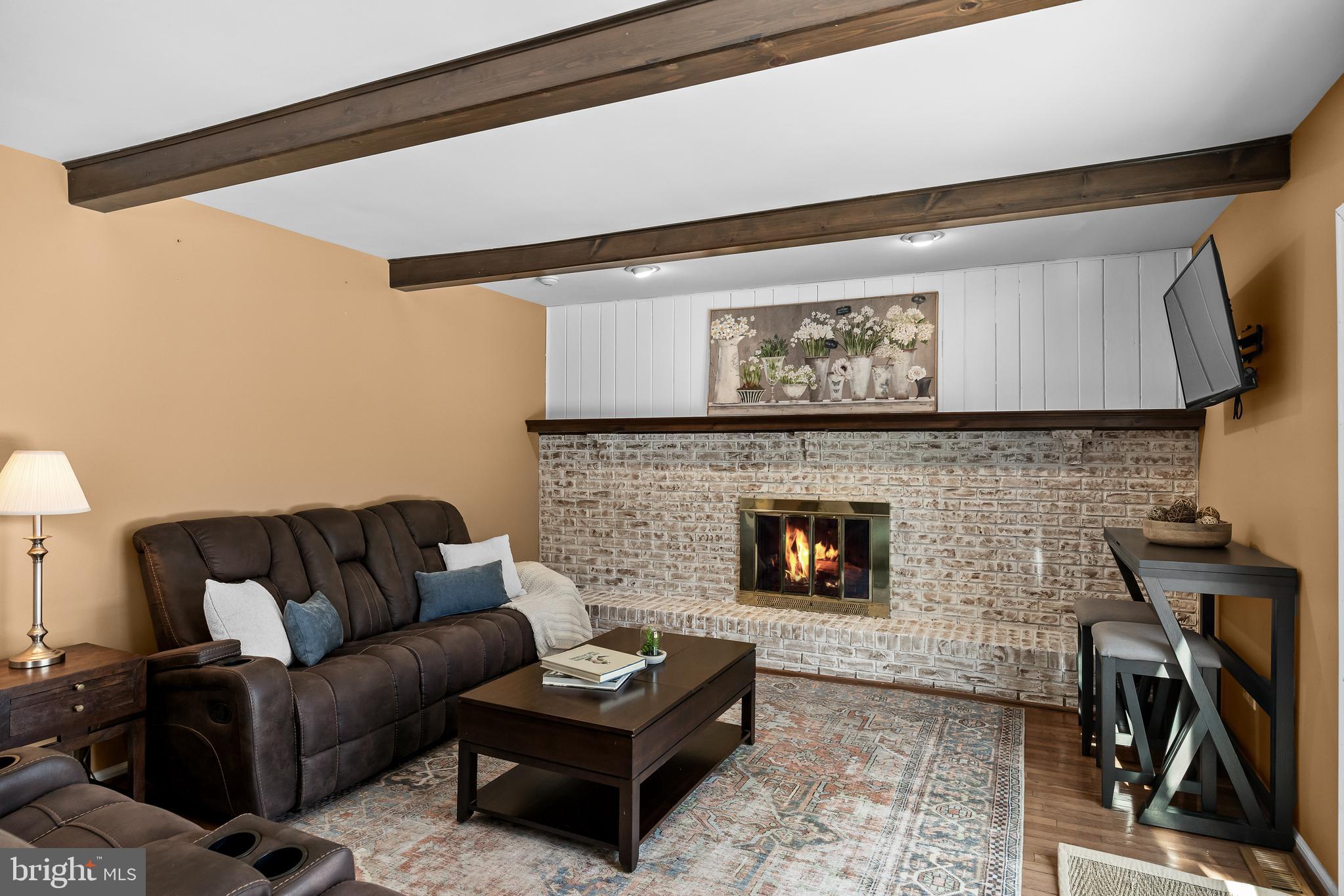 10 Lexington Court Shamong, NJ 08088 - Photo 14 of 47 a living room with furniture and a fireplace