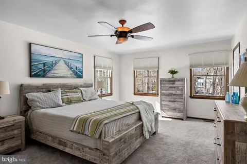 a bedroom with a large bed and a window