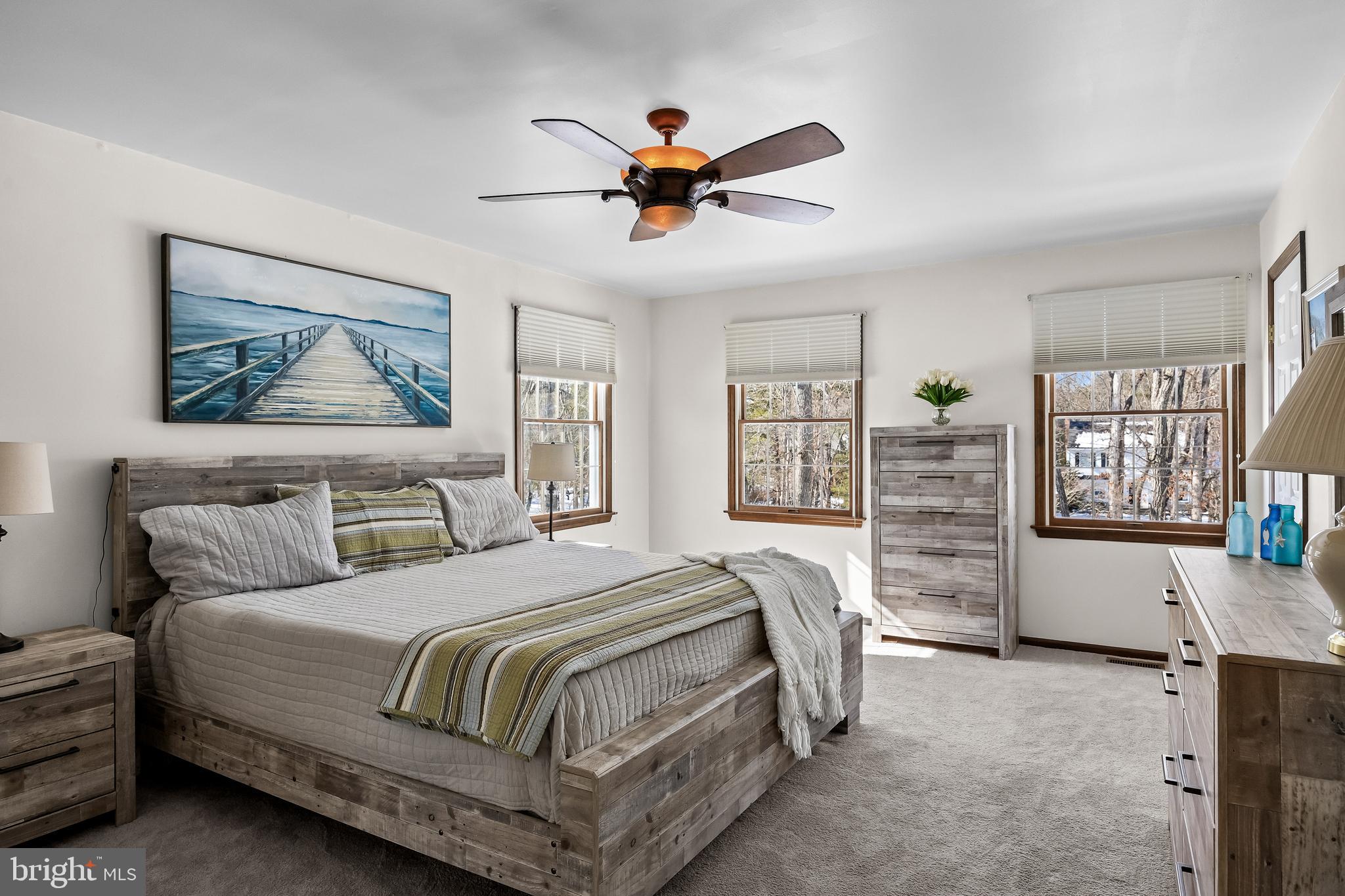 10 Lexington Court Shamong, NJ 08088 - Photo 18 of 47 a bedroom with a large bed and a window