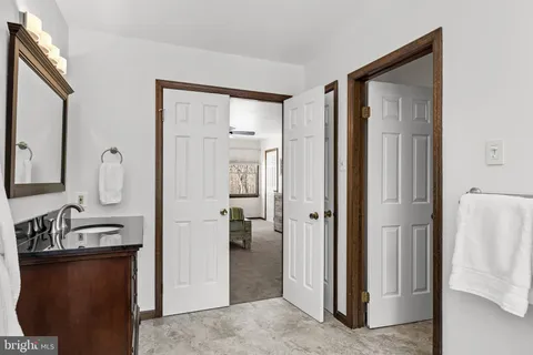 a view of a bathroom from a hallway