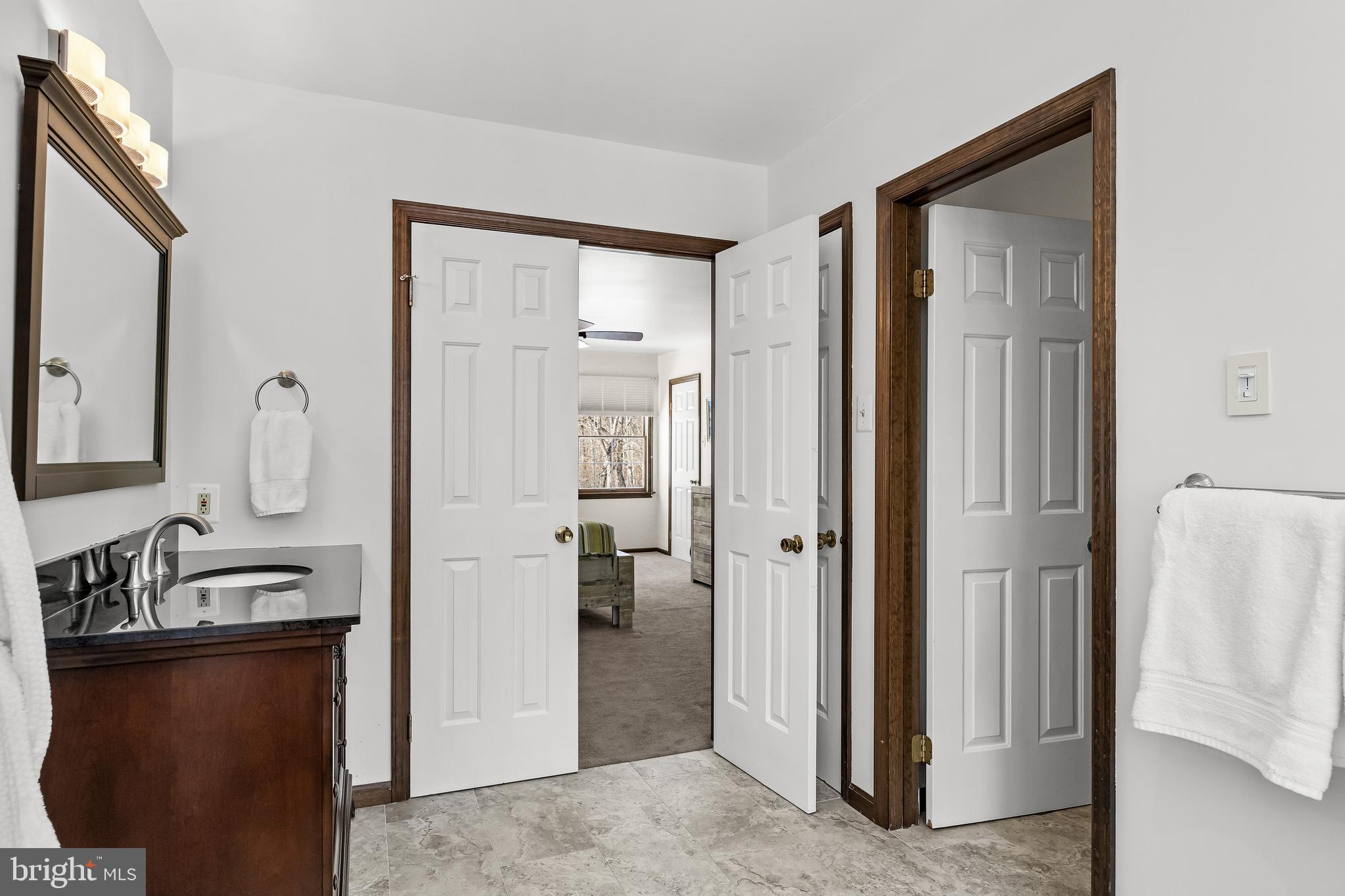 10 Lexington Court Shamong, NJ 08088 - Photo 22 of 47 a view of a bathroom from a hallway