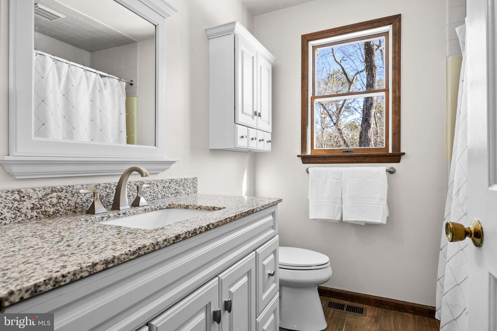 10 Lexington Court Shamong, NJ 08088 - Photo 27 of 47 a bathroom with a granite countertop sink a toilet and mirror