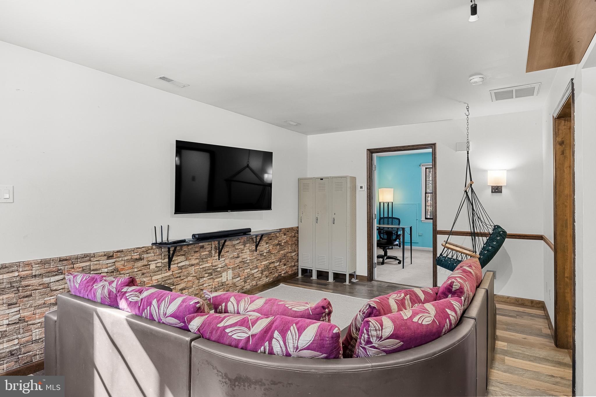 10 Lexington Court Shamong, NJ 08088 - Photo 29 of 47 a living room with furniture and a flat screen tv