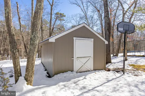 a view of a house with a snow in the yard