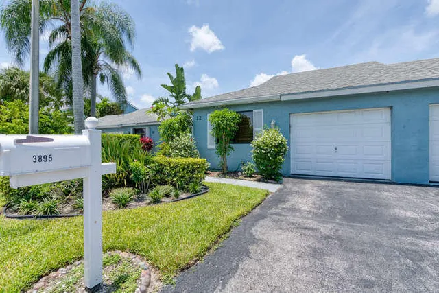 a view of lake with a house in the background