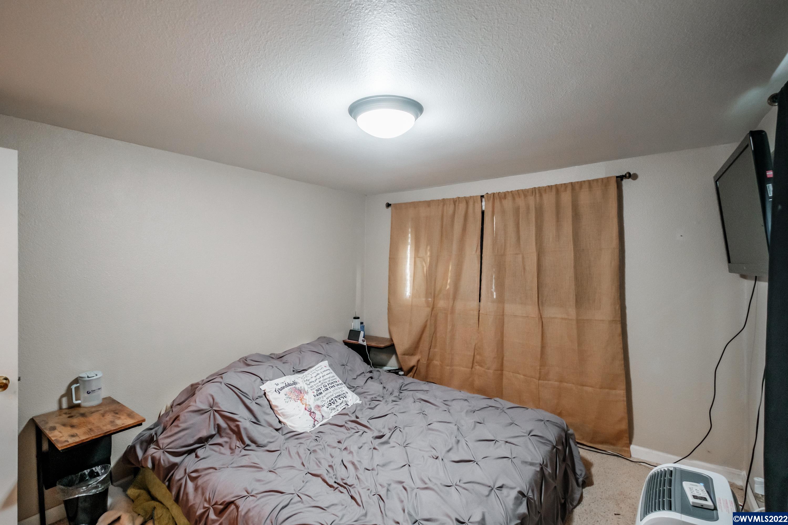 4725 Knox Butte Road East Albany, OR 97322 - Photo 24 of 41 a bedroom with a bed and a tv