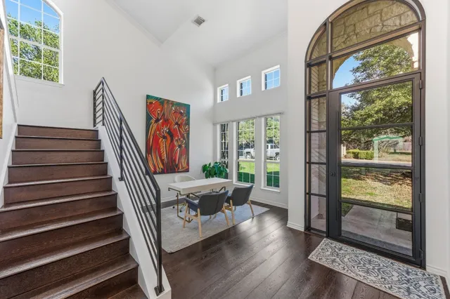a view of entryway with wooden floor and door