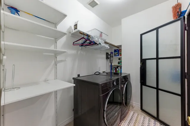 a kitchen with stainless steel appliances a refrigerator and a sink