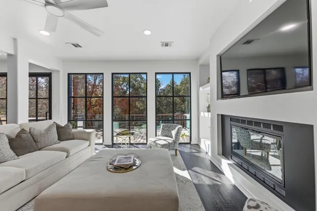 a living room with furniture and a fireplace