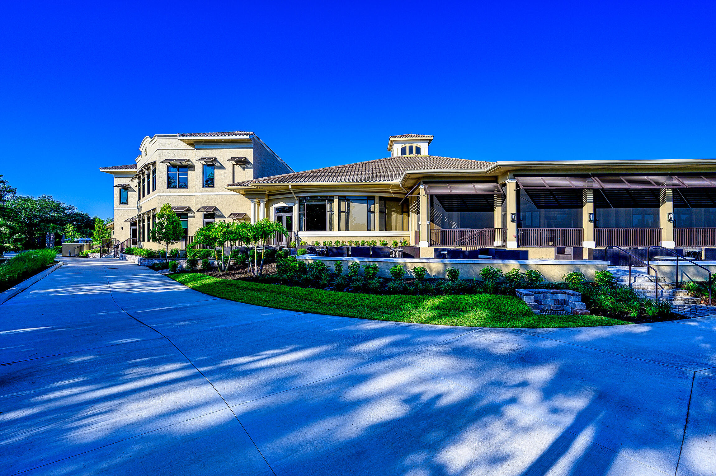 8660 Cedar Hammock Circle, Unit 314 Naples, FL 34112 - Photo 25 of 31 a front view of a house with a yard