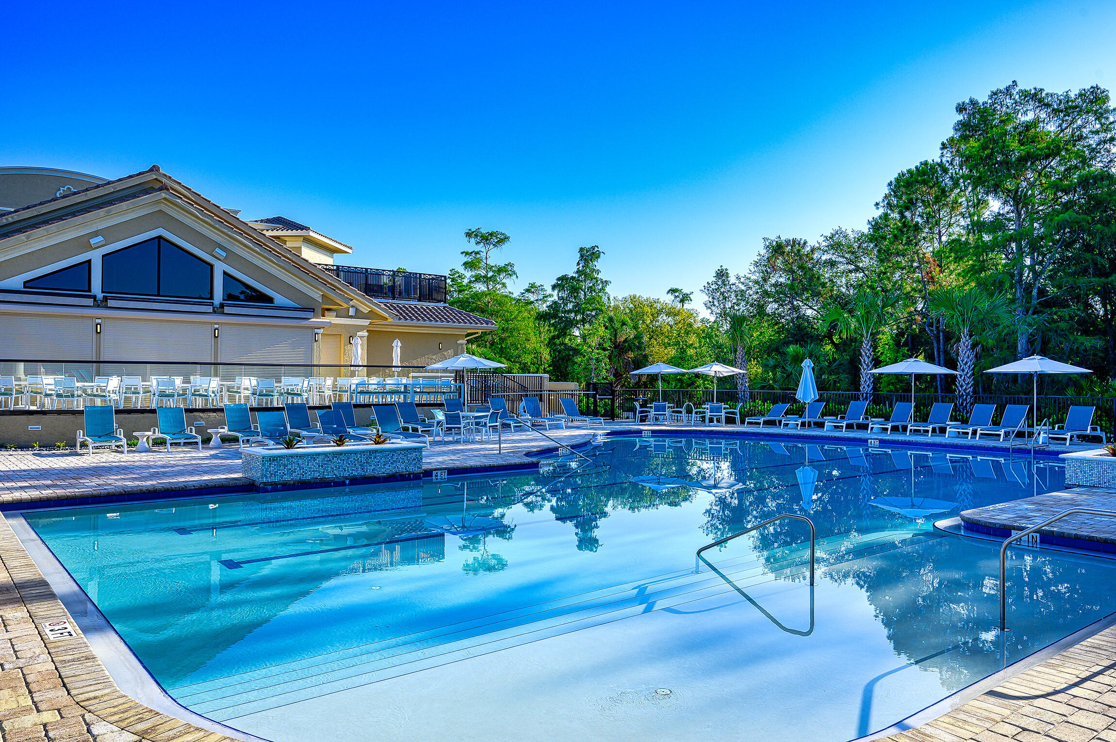 8660 Cedar Hammock Circle, Unit 314 Naples, FL 34112 - Photo 27 of 31 a view of a house with pool