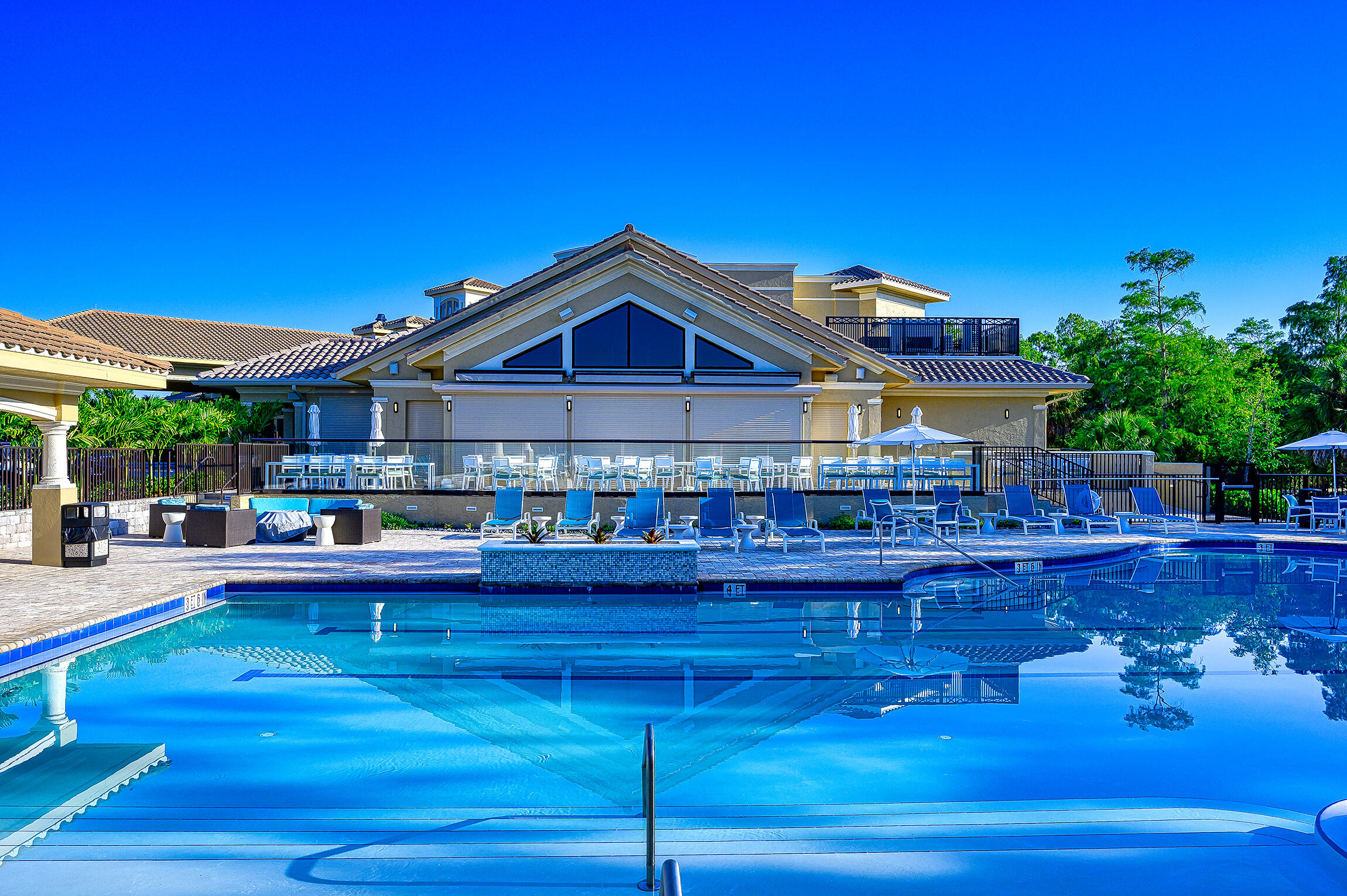 8660 Cedar Hammock Circle, Unit 314 Naples, FL 34112 - Photo 28 of 31 a view of a house with pool