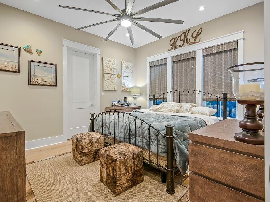 277 Matt's Way Santa Rosa Beach, FL 32459 - Photo 15 of 37 a bedroom with bed and a chandelier