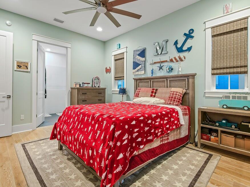 277 Matt's Way Santa Rosa Beach, FL 32459 - Photo 21 of 37 a bedroom with a bed and a book shelf