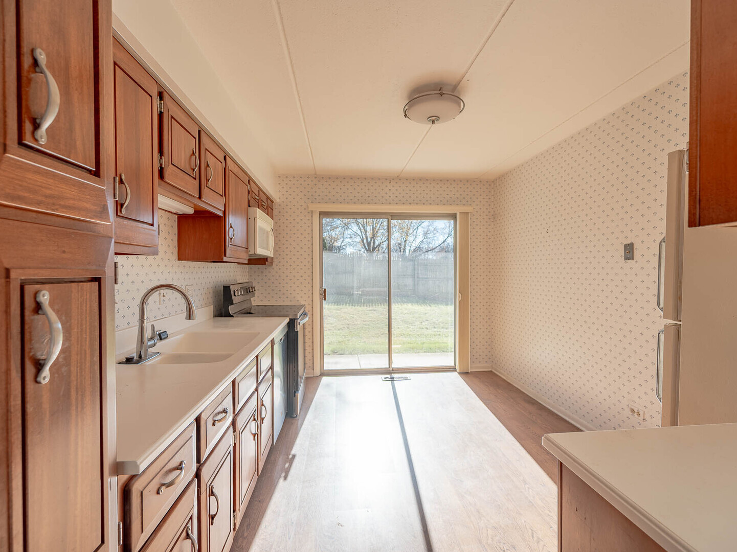 5818 Wolf Road, Unit 1A Western Springs, IL 60558 - Photo 5 of 14 a view of a kitchen with a sink and windows