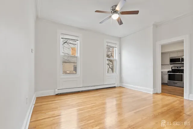 a view of empty room with ceiling fan
