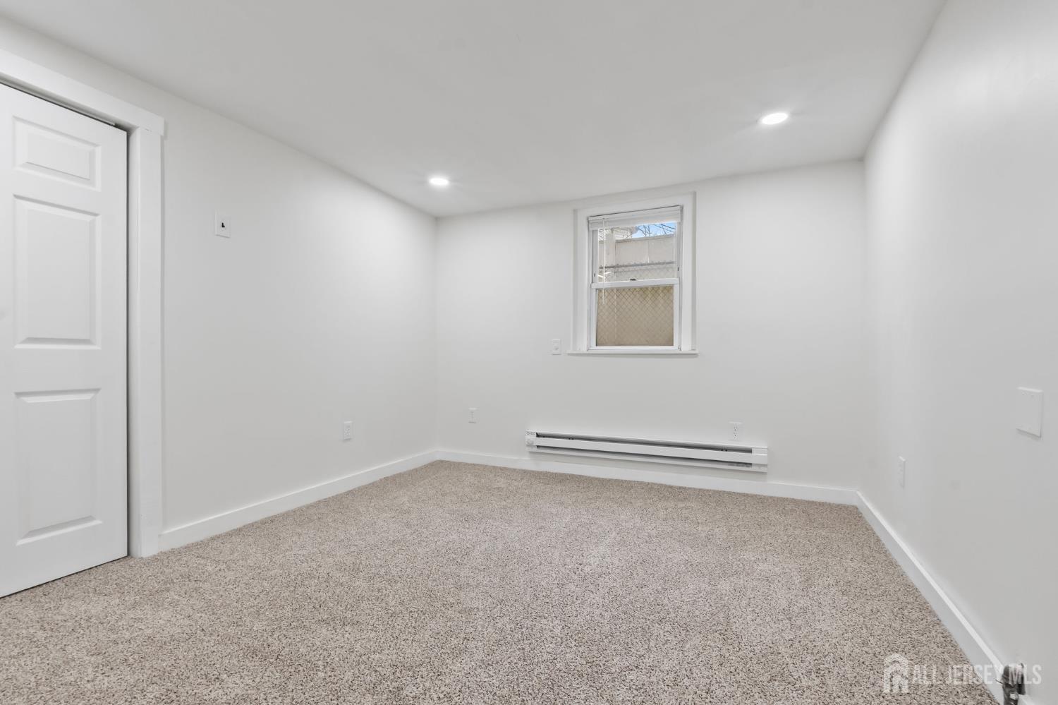 20 Linden Court, Unit 1 Jersey City, NJ 07305 - Photo 25 of 33 an empty room with a workbench