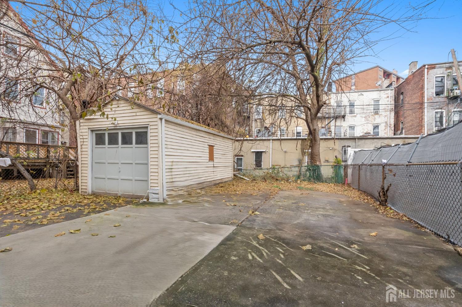 20 Linden Court, Unit 1 Jersey City, NJ 07305 - Photo 32 of 33 a backyard of a house with large trees