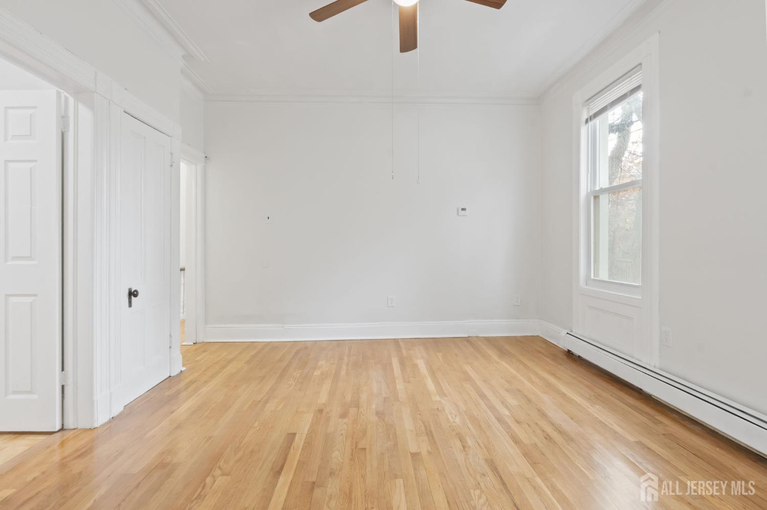 20 Linden Court, Unit 1 Jersey City, NJ 07305 - Photo 9 of 33 wooden floor in an empty room