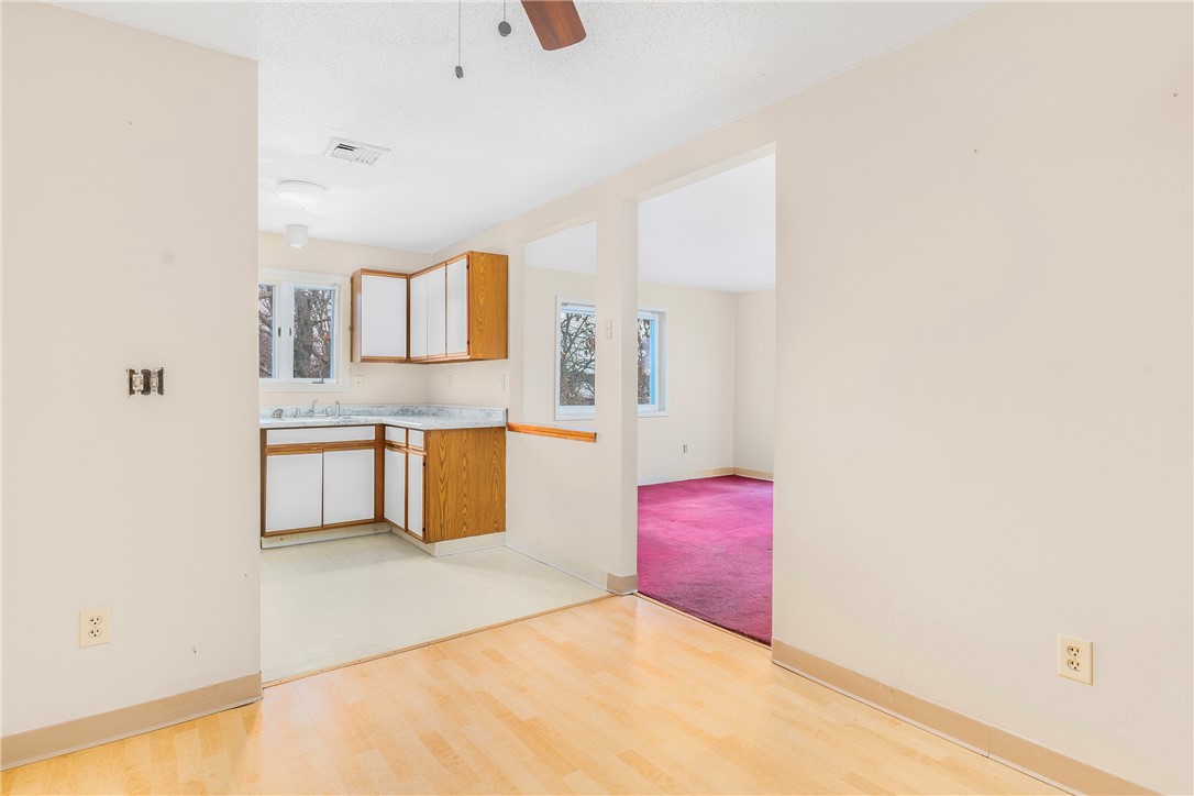 728 Beverage Hill Avenue, Unit 35 Pawtucket, RI 02861 - Photo 2 of 13 Dining area to kitchen to living room