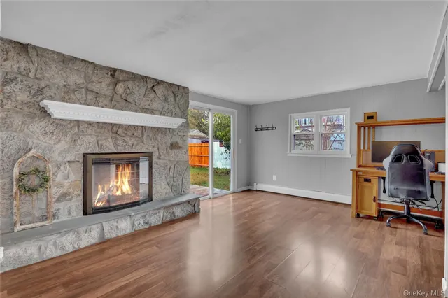 a view of a livingroom with furniture and a fireplace