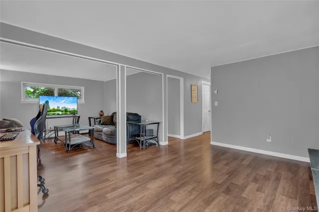 a view of a livingroom with furniture and wooden floor