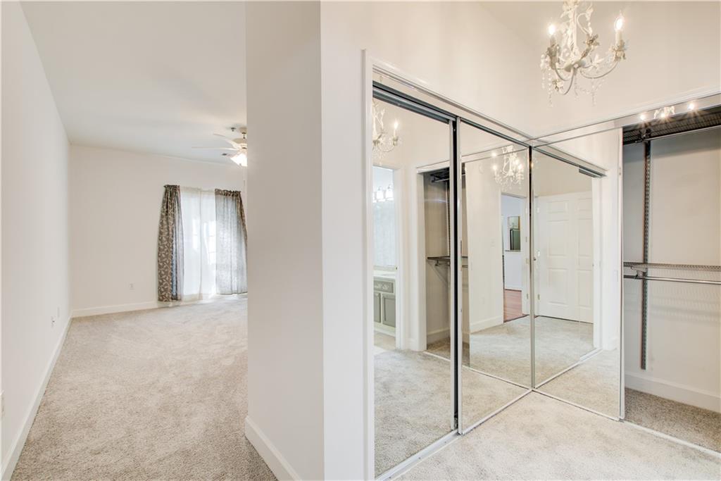 2865 Lenox Road Northeast, Unit 102 Atlanta, GA 30324 - Photo 23 of 35 a view of an empty room and a glass door