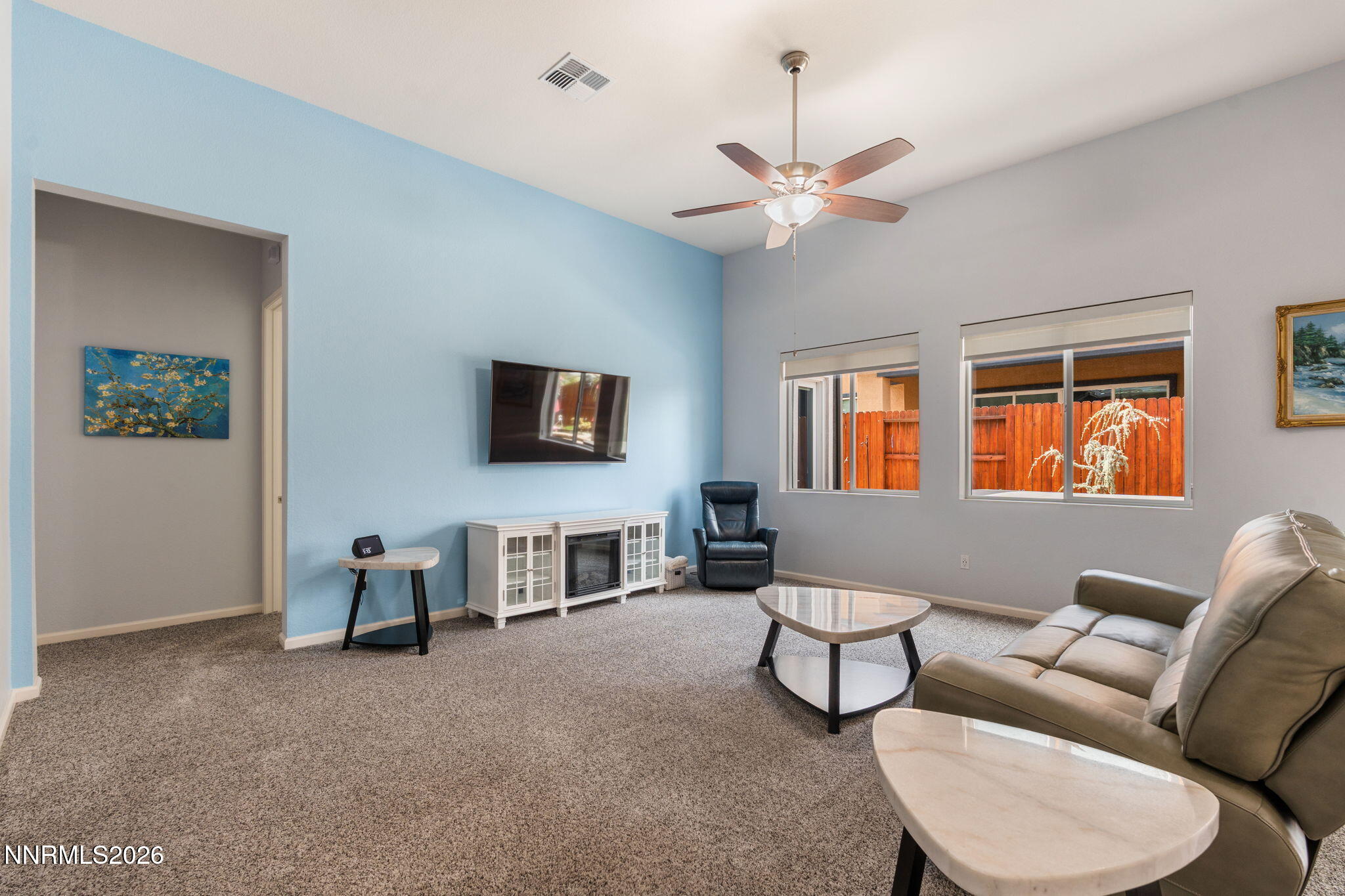 9401 Baldacci Road Reno, NV 89521 - Photo 11 of 42 a living room with furniture a flat screen tv and a window