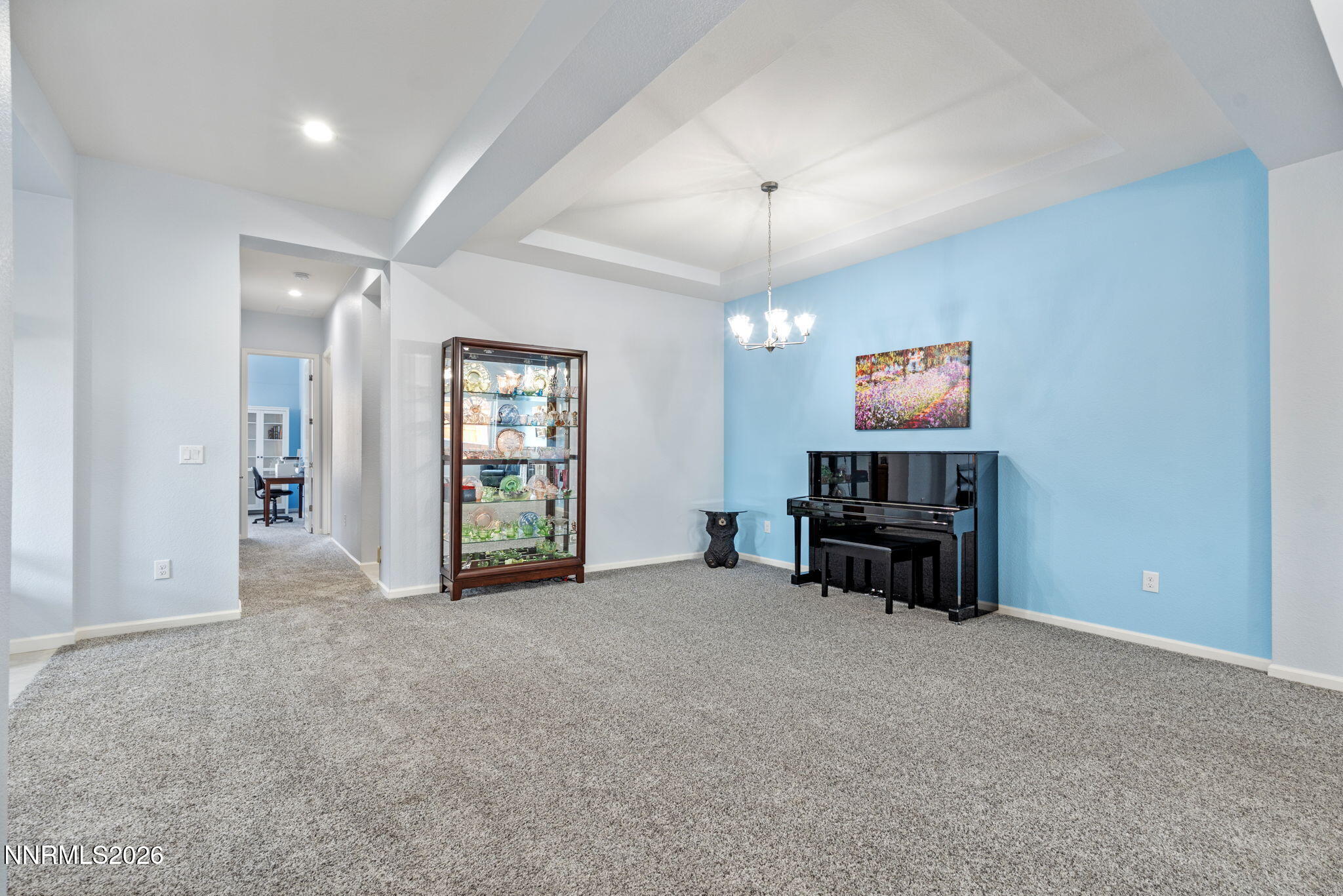 9401 Baldacci Road Reno, NV 89521 - Photo 16 of 42 an empty room with furniture and a chandelier