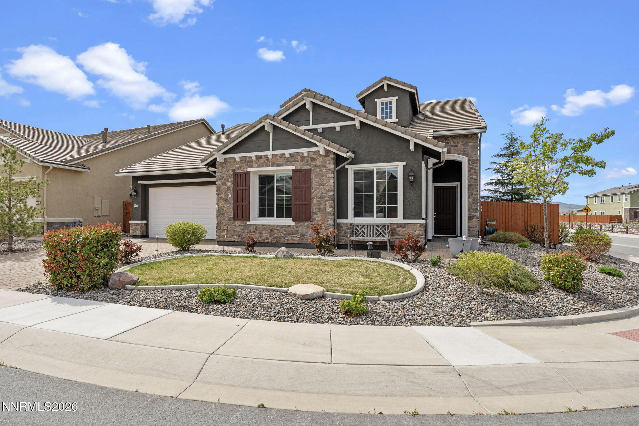 9401 Baldacci Road Reno, NV 89521 - Photo 2 of 42 a front view of a house with garden