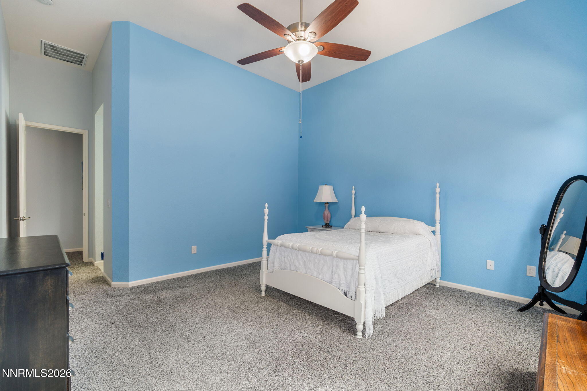 9401 Baldacci Road Reno, NV 89521 - Photo 21 of 42 a bed room with a bed and a ceiling fan