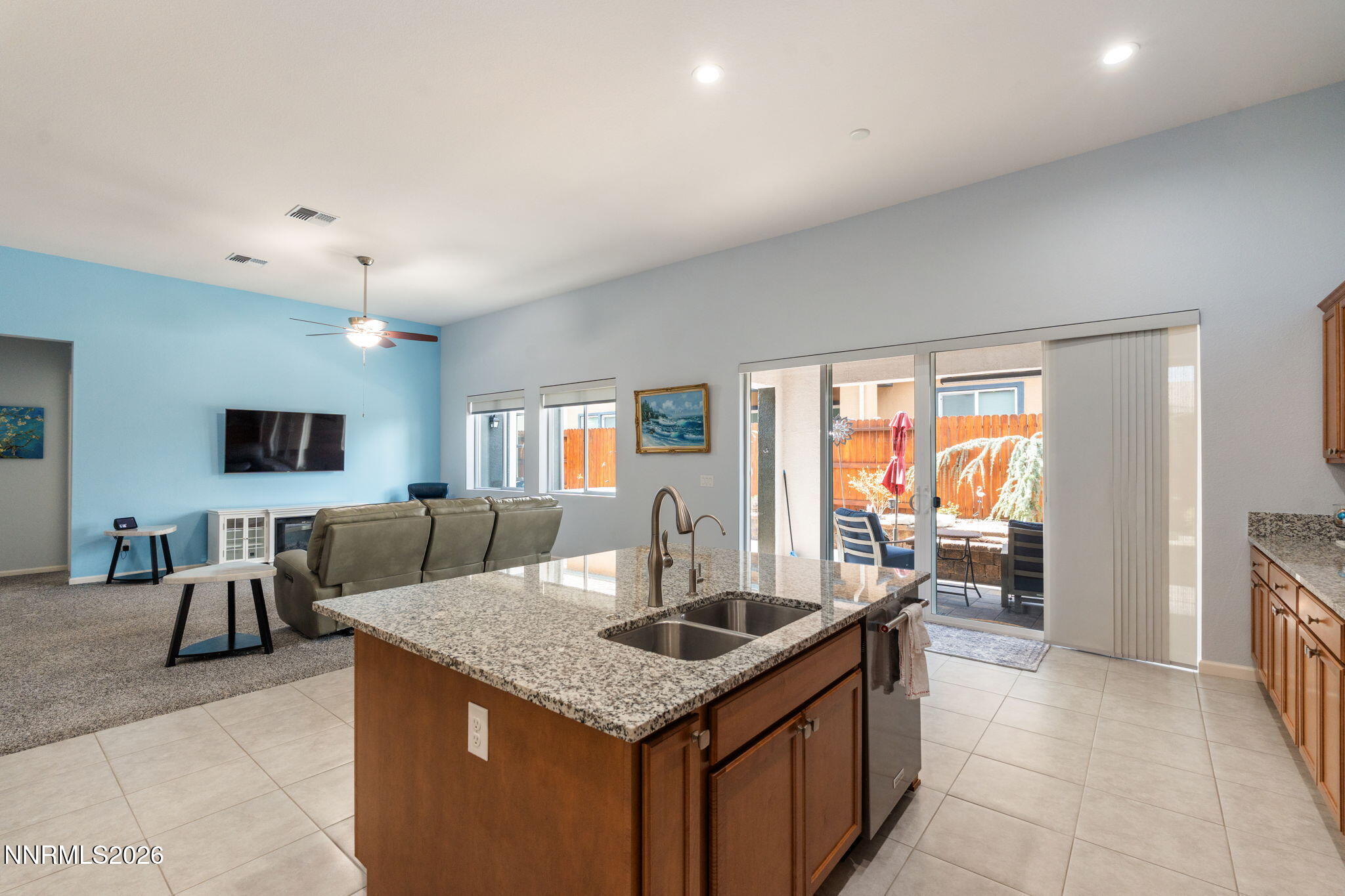 9401 Baldacci Road Reno, NV 89521 - Photo 6 of 42 a kitchen with stainless steel appliances granite countertop a sink and a refrigerator