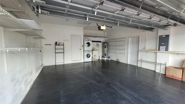 a view of a room with wooden floors