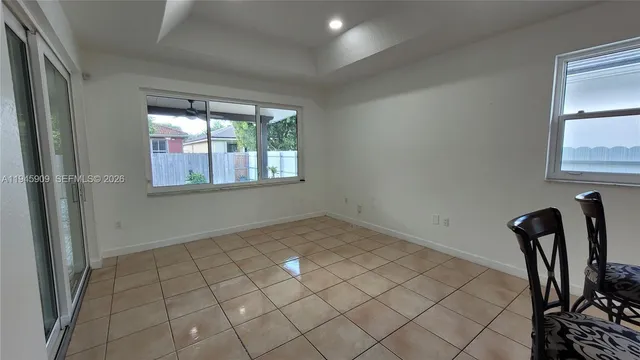 a view of an empty room and window