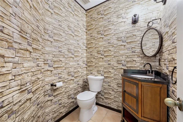 a bathroom with a toilet and a sink