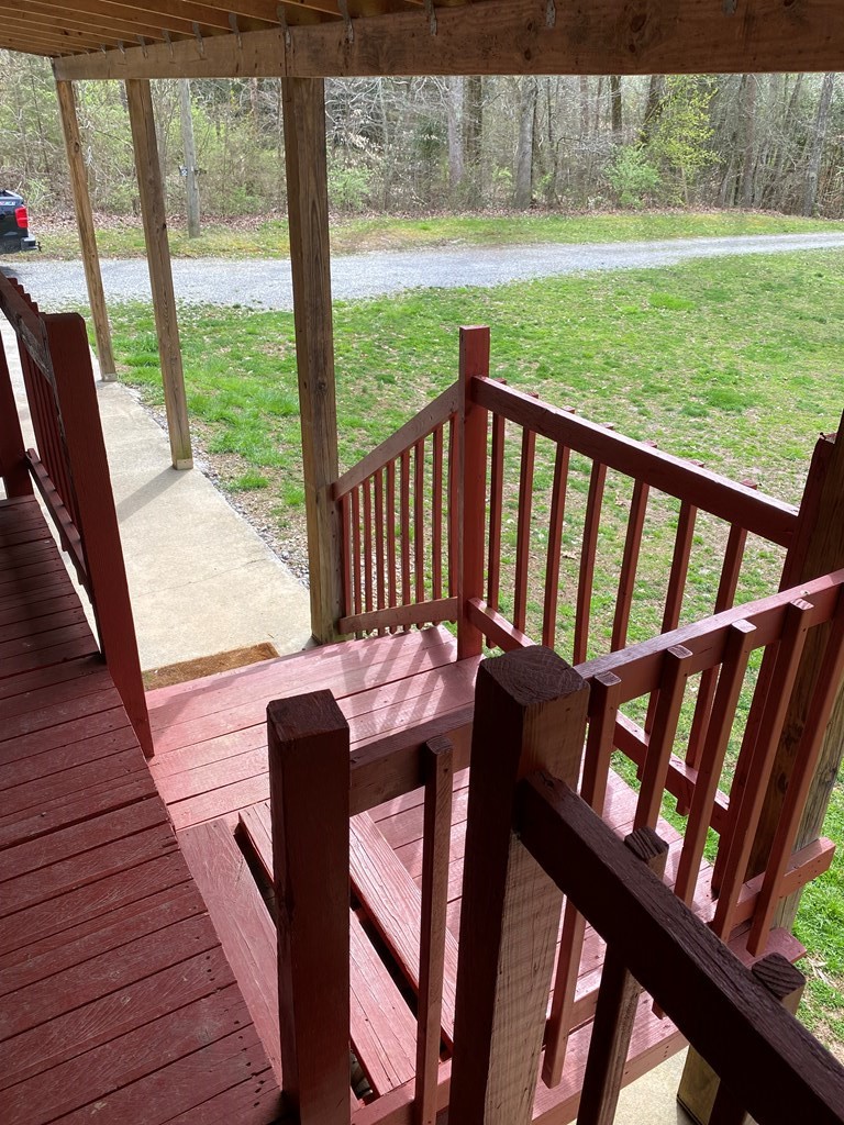 175 Fairview Road Athens, TN 37303 - Photo 16 of 46 a view of a porch with furniture and wooden deck