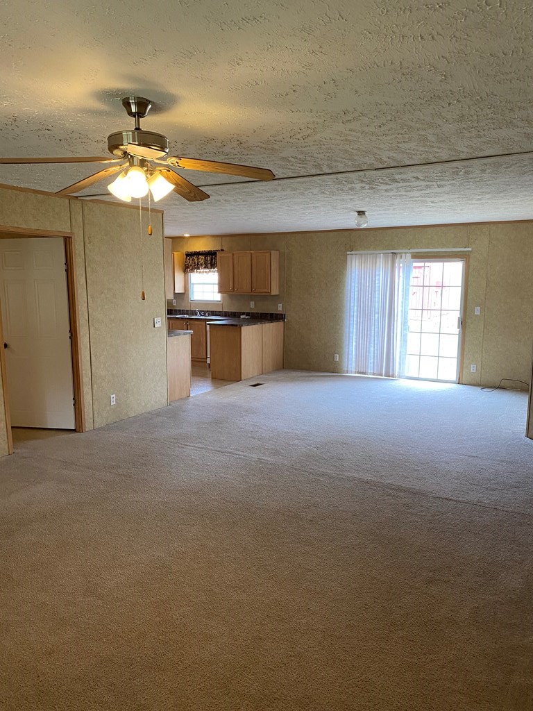 175 Fairview Road Athens, TN 37303 - Photo 20 of 46 a view of a livingroom with a ceiling fan and window