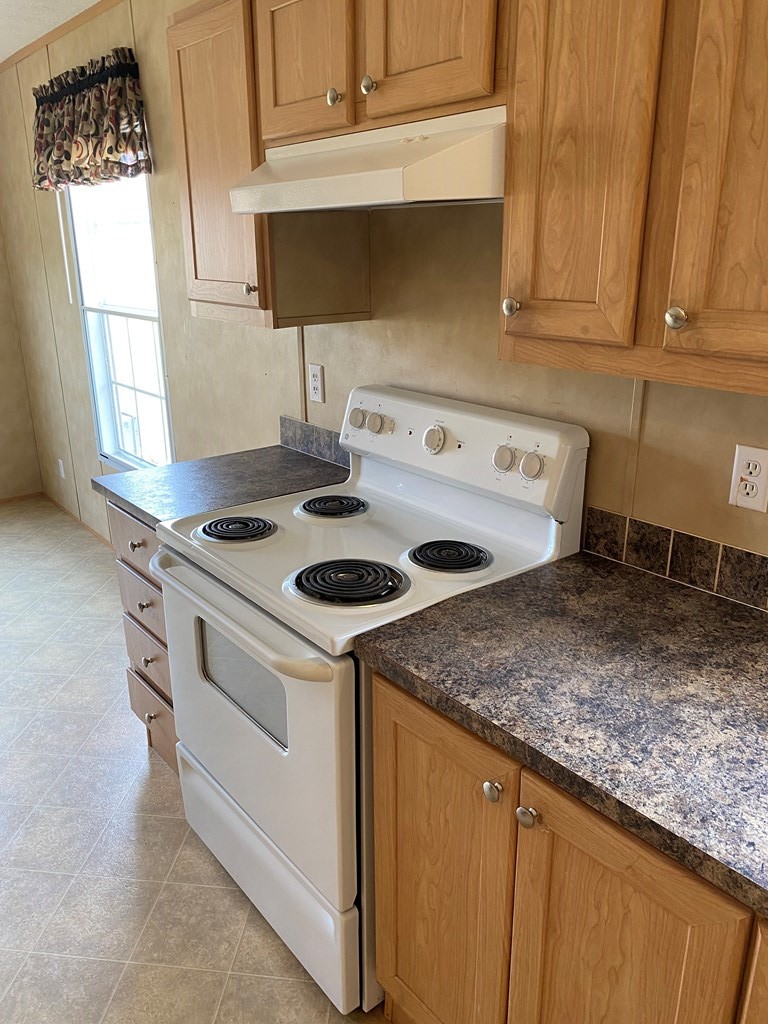 175 Fairview Road Athens, TN 37303 - Photo 24 of 46 a kitchen with a stove and a sink