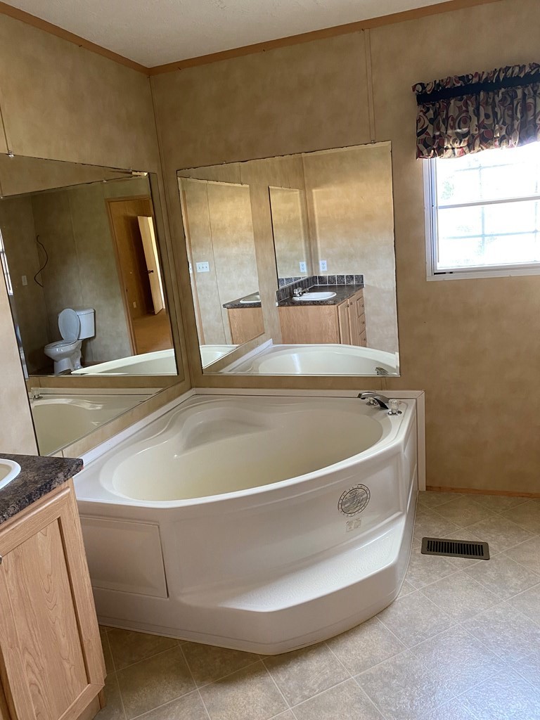 175 Fairview Road Athens, TN 37303 - Photo 36 of 46 a bath tub sitting next to a window