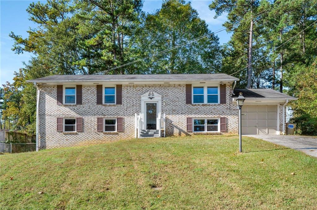 3106 Sasanqua Lane Southwest Marietta, GA 30008 - Photo 1 of 1 a view of a house with a yard